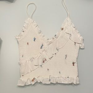 White rouched ruffle tank top with floral design